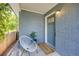 Cozy front porch with stylish chair and decorative accents at 1765 Xenia St, Denver, CO 80220