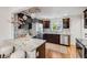 Modern kitchen featuring stainless steel appliances, granite countertops, and ample cabinet space at 1765 Xenia St, Denver, CO 80220