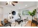 Bright living room featuring modern furnishings and a large window at 1765 Xenia St, Denver, CO 80220