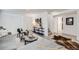 Bright living room with modern decor, stylish furniture, and plank flooring at 1765 Xenia St, Denver, CO 80220