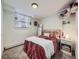 Cozy bedroom with carpet floors, white walls, and a window at 1374 N Ogden St # C, Denver, CO 80218