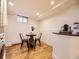 Efficient dining area featuring a small table, seating for four, and modern appliances at 1374 N Ogden St # C, Denver, CO 80218