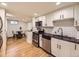 Well-equipped kitchen with stainless steel appliances, white cabinetry, and subway tile backsplash at 1374 N Ogden St # C, Denver, CO 80218