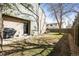 View of the backyard with patio and door to the house at 3471 S Ammons St # 12-6, Lakewood, CO 80227