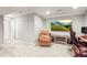 Cozy basement with comfortable seating, television and carpeting at 3471 S Ammons St # 12-6, Lakewood, CO 80227