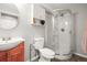 Well-lit bathroom featuring a modern vanity and stand-up shower with a curved glass enclosure at 3471 S Ammons St # 12-6, Lakewood, CO 80227