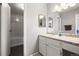 Bathroom featuring a sink vanity, medicine cabinet, and large mirror at 3471 S Ammons St # 12-6, Lakewood, CO 80227