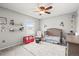 Charming Bedroom with plush carpet, ceiling fan, and neutral paint perfect for a growing Gathering at 3471 S Ammons St # 12-6, Lakewood, CO 80227