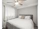 Cozy bedroom with a ceiling fan and a plush bed perfect for a great night's sleep at 3471 S Ammons St # 12-6, Lakewood, CO 80227