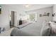 Bright bedroom with a ceiling fan and a window, offering a comfortable living space at 3471 S Ammons St # 12-6, Lakewood, CO 80227