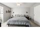 Spacious bedroom with modern decor, including sconces and matching bedside tables at 3471 S Ammons St # 12-6, Lakewood, CO 80227