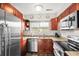 A lovely kitchen featuring granite countertops, stainless steel appliances, and well-lit interior at 3471 S Ammons St # 12-6, Lakewood, CO 80227