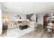 Spacious living room with staircase, large sectional sofa, and open layout, ideal for modern living at 3471 S Ammons St # 12-6, Lakewood, CO 80227