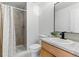 Updated bathroom featuring tile flooring, granite vanity and a shower with a curtain at 2901 Wyandot St # 18, Denver, CO 80211