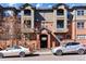 Exterior view of the building displaying a brick entrance below the sign reading 'Highland Court' at 2901 Wyandot St # 18, Denver, CO 80211