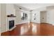 Elegant living room featuring gleaming wood floors, a stylish fireplace, bright windows, and a neutral color scheme for a modern feel at 2901 Wyandot St # 18, Denver, CO 80211