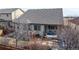 Aerial view of backyard showing the patio with pergola and fenced yard at 5280 Longs Peak St, Brighton, CO 80601