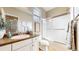 Well-lit bathroom with a glass-enclosed shower and elegant vanity, blending style and functionality at 5280 Longs Peak St, Brighton, CO 80601