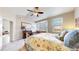 Spacious bedroom with fireplace and bay window, creating a warm and inviting atmosphere for relaxation at 5280 Longs Peak St, Brighton, CO 80601