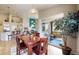Bright dining area with sliding glass doors to the patio, seamlessly connected to the kitchen and living room at 5280 Longs Peak St, Brighton, CO 80601