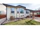 Exterior view of the home showcasing a bay window and landscaped yard at 5280 Longs Peak St, Brighton, CO 80601