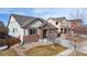 Exterior elevation of the front of the house, showing the brick and siding details at 5280 Longs Peak St, Brighton, CO 80601