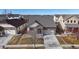 Charming brick two-story home with well-manicured lawn and a two car garage at 5280 Longs Peak St, Brighton, CO 80601