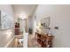 Bright hallway with natural light, console table, and decorative accents, creating a welcoming and stylish transition space at 5280 Longs Peak St, Brighton, CO 80601