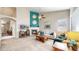 Inviting living room with a cozy fireplace, complemented by stylish decor and ample natural light at 5280 Longs Peak St, Brighton, CO 80601