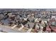 Wide aerial shot of the neighborhood showcasing many homes and community layout at 5280 Longs Peak St, Brighton, CO 80601