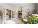 Cozy office space with French doors, bookshelf, and stylish decor, offering a functional work-from-home environment at 5280 Longs Peak St, Brighton, CO 80601