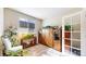 Bright office space with a large window, wood storage and door at 5280 Longs Peak St, Brighton, CO 80601