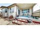 Inviting covered patio with a view of the landscaped backyard and decorative elements at 5280 Longs Peak St, Brighton, CO 80601
