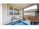 Charming covered patio with outdoor seating and a view of the backyard at 5280 Longs Peak St, Brighton, CO 80601