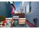 Backyard patio featuring stylish outdoor seating with plush cushions and a patterned rug, perfect for outdoor gatherings at 9690 E 5Th Ave, Denver, CO 80230