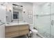 Modern bathroom features a stylish vanity, large mirror, and glass-enclosed shower at 9690 E 5Th Ave, Denver, CO 80230
