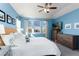This bedroom features three large dressers, a ceiling fan, and a bright and sunny window at 9690 E 5Th Ave, Denver, CO 80230