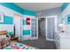 A spacious bedroom with unique blue and white striped walls and multiple doors at 9690 E 5Th Ave, Denver, CO 80230