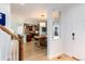 Inviting foyer with hardwood floors, leading to the kitchen and dining area, creating a welcoming entry to the home at 9690 E 5Th Ave, Denver, CO 80230
