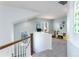 Cozy loft area perfect as a flexible living space and featuring a window and neutral carpeting at 9690 E 5Th Ave, Denver, CO 80230