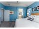 A calming main bedroom featuring a walk-through to the bathroom suite at 9690 E 5Th Ave, Denver, CO 80230