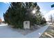 Stone sign features a star emblem surrounded by rocks and foliage alongside a well-maintained sidewalk at 9690 E 5Th Ave, Denver, CO 80230