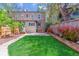 Lovely backyard featuring lush green lawn and neat garden beds, perfect for outdoor enjoyment at 761 N Lafayette St, Denver, CO 80218