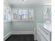 Bright breakfast nook featuring white shutters, dark hardwood floors and light blue walls, with marble counter on white cabinets at 761 N Lafayette St, Denver, CO 80218