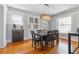 Elegant dining room with hardwood floors, built-in cabinets, and modern light fixture at 761 N Lafayette St, Denver, CO 80218