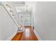 Bright foyer with hardwood floors, staircase, and elegant chandelier at 761 N Lafayette St, Denver, CO 80218