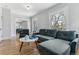 Inviting living room with hardwood floors, large windows, and comfortable seating, creating a cozy and bright atmosphere at 761 N Lafayette St, Denver, CO 80218