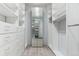Spacious walk-in closet with ample storage, featuring built-in shelving and a large mirror for convenience at 761 N Lafayette St, Denver, CO 80218
