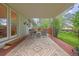 Inviting covered back deck with seating and a stylish outdoor rug, perfect for relaxing and entertaining at 2871 Humboldt Cir, Longmont, CO 80503