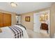 Bedroom featuring a large bed and ensuite bathroom at 2871 Humboldt Cir, Longmont, CO 80503